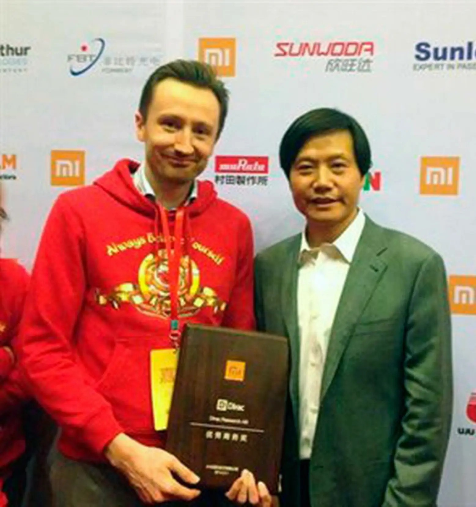 Receiving Supplier of the Year award and meeting with Lei Jun, founder and CEO of Xiaomi, in 2014
